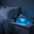 Tissue box with ocean design on a nightstand next to a bed